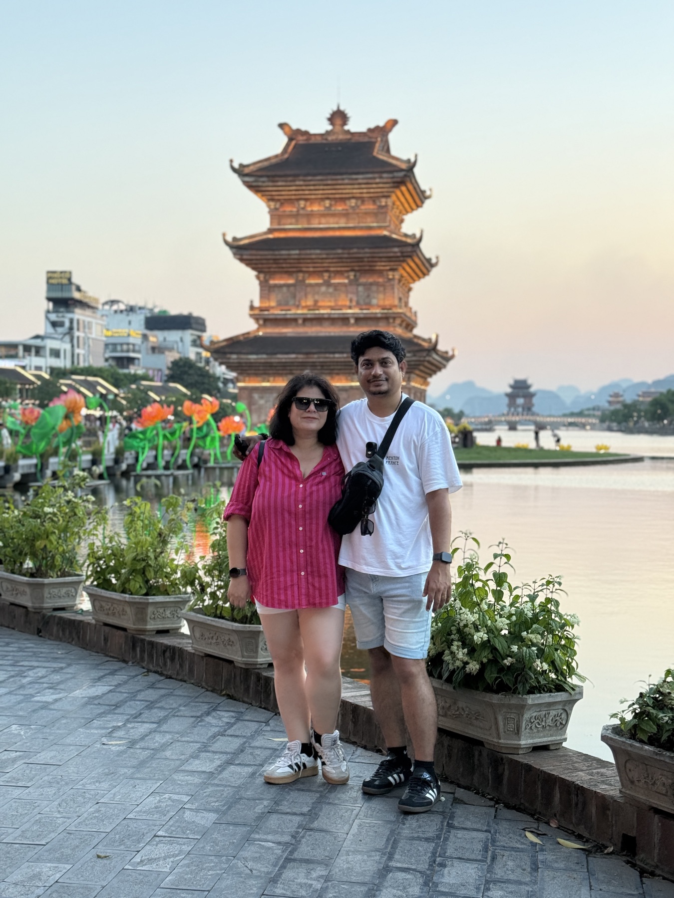 Prashant and Sunaina at a pagoda at sunset